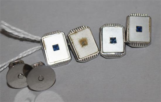 A pair of 9ct white gold, mother of pearl and gem set cufflinks and a pair of dress studs ( one stone missing).